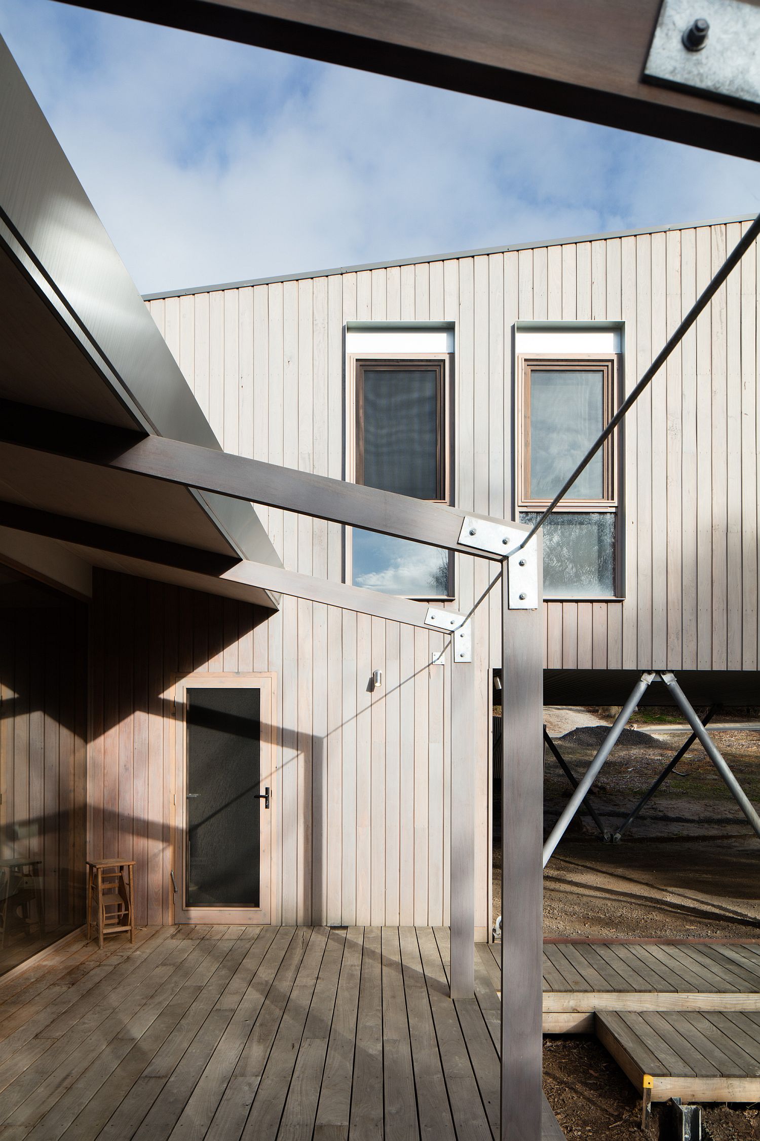 Fire-resistant wood and concrete on the oustide makes the house much safer in the bushland