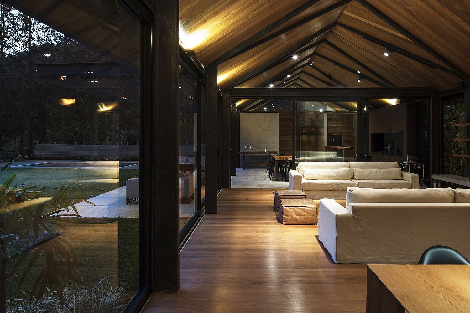 Floor-to-ceiling glass walls and sliding glass doors of the AS House