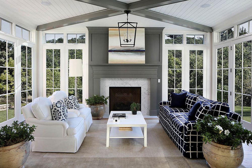 Giving the sunroom a makeover with the bright blue couch