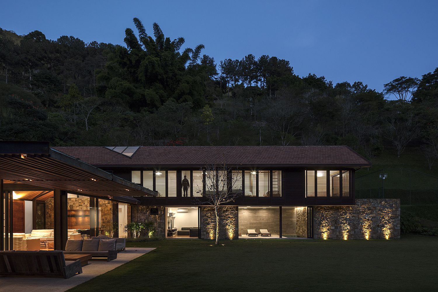 Gorgeous lighting and lovely natural landscape add to the beauty of the AS House