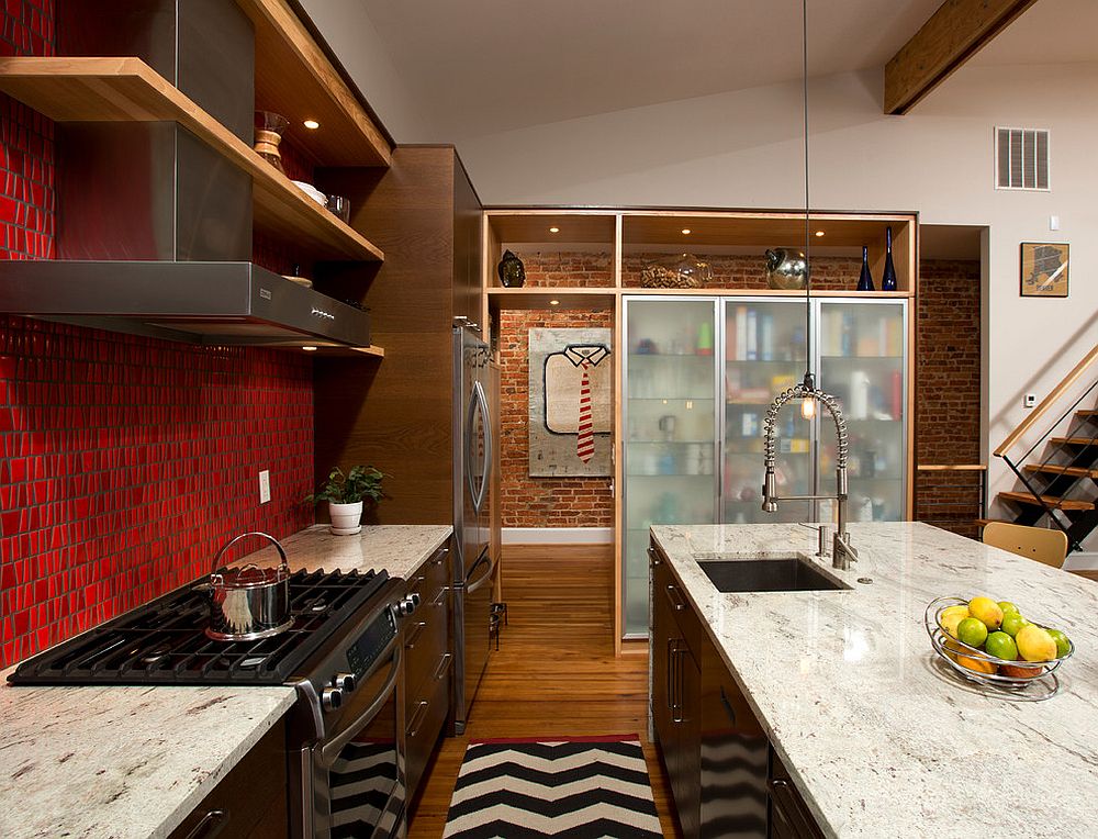 Gorgeous pantry with frosted glass doors set against a brick wall backdrop