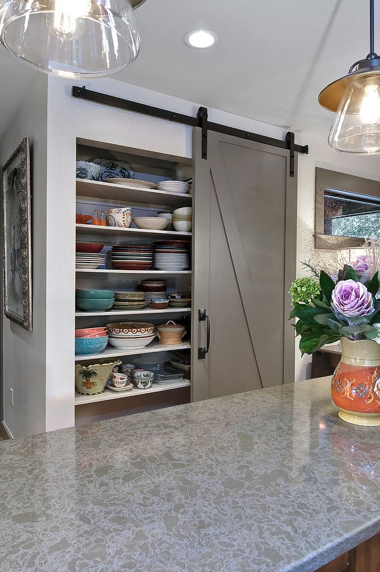 Gray barn style sliding door for the transitional kitchen pantry