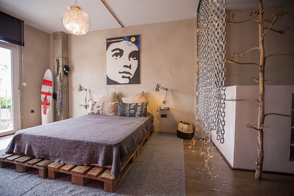 Industrial eclectic bedroom with minimal wooden bed frame and string lights
