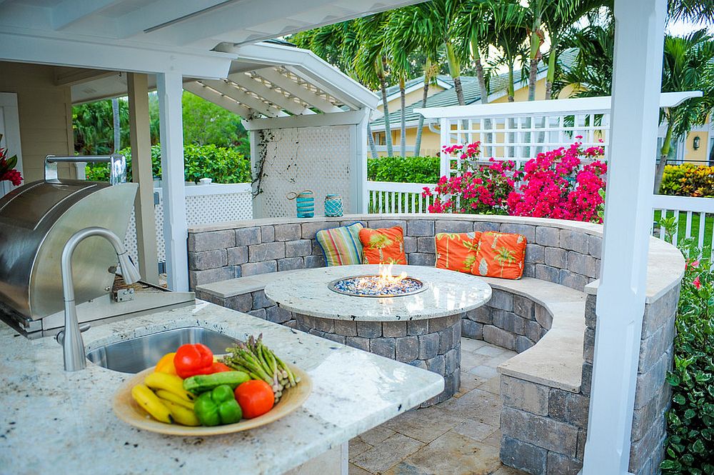 Integrating the outdoor kitchen with the fire pit and the seating around it