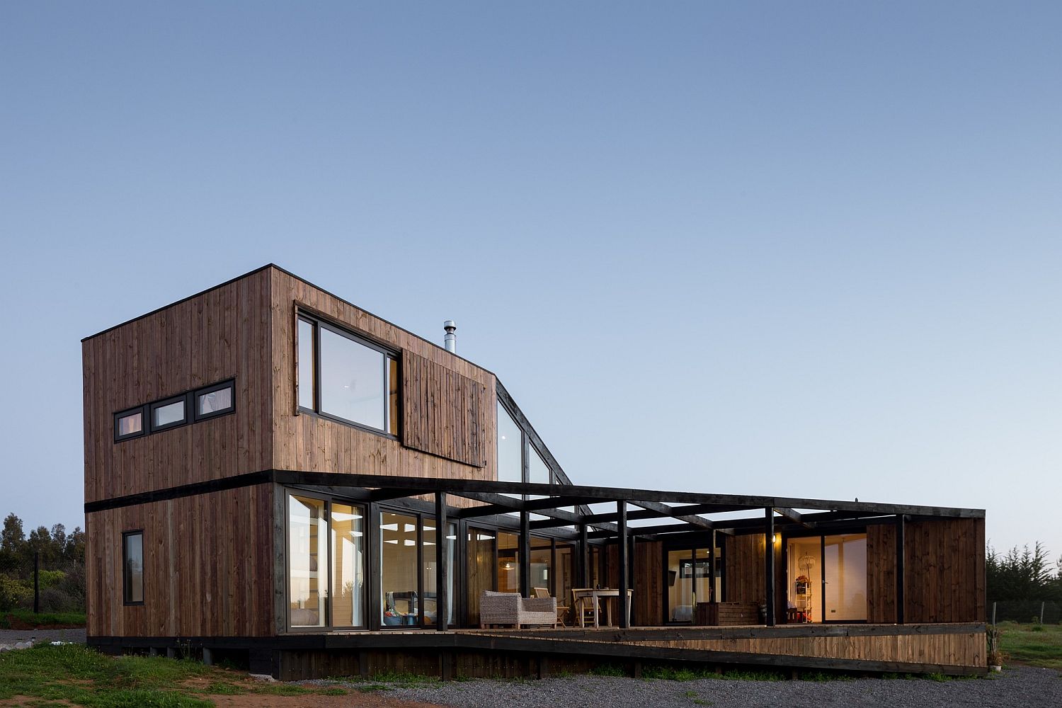 L-shaped home with distant ocean views and a spacious courtyard