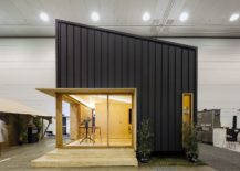 Metal-panels-and-angled-roof-shape-the-exterior-of-this-tiny-sustainable-home-217x155