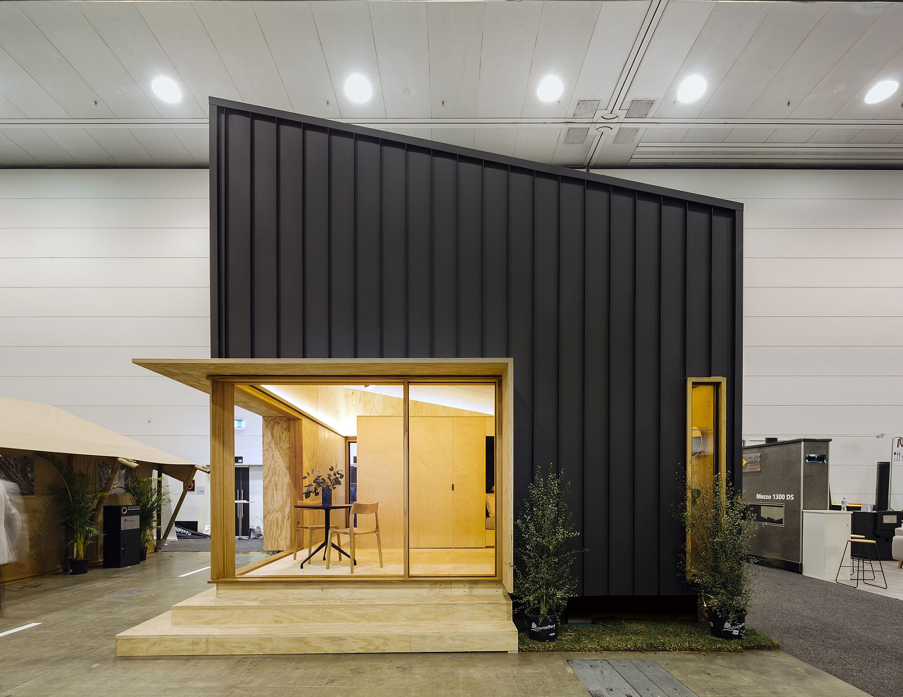 Metal-panels-and-angled-roof-shape-the-exterior-of-this-tiny-sustainable-home