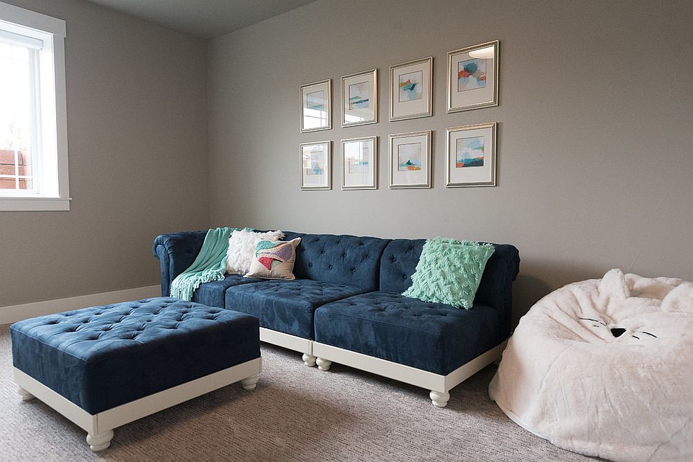 Navy blue coupled with white in the small, gray family room