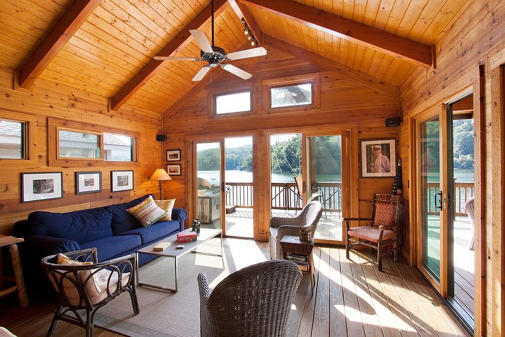 Navy blue sofa stands out visually in this spacious traditional living room