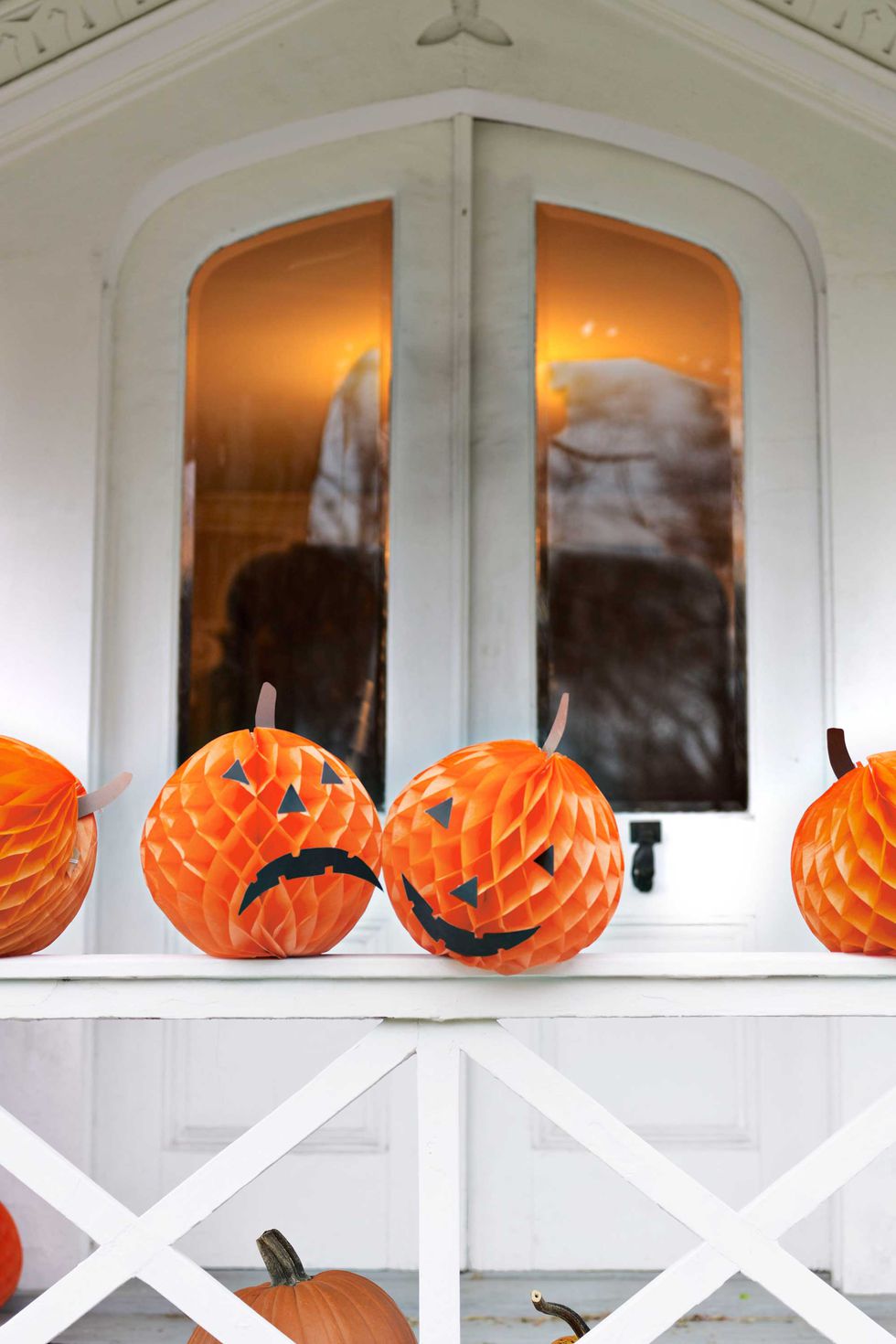 Orange tissue paper replaces pumpkins in this cool Halloween decorating idea