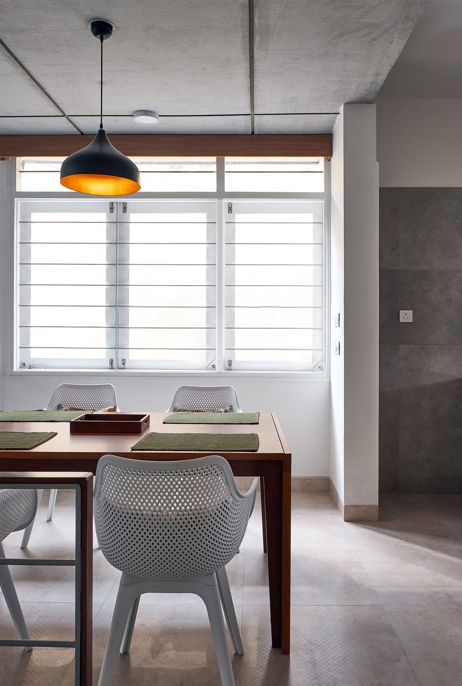 Pendant light adds color and class to the dining area