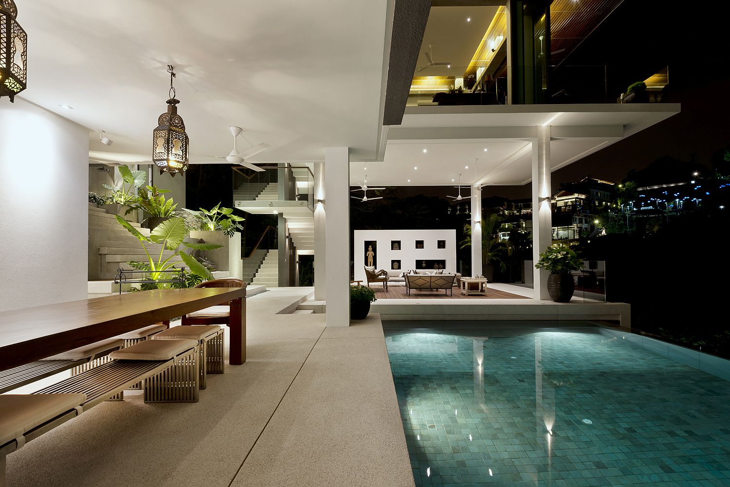 Pool area at night with bright, white lighting