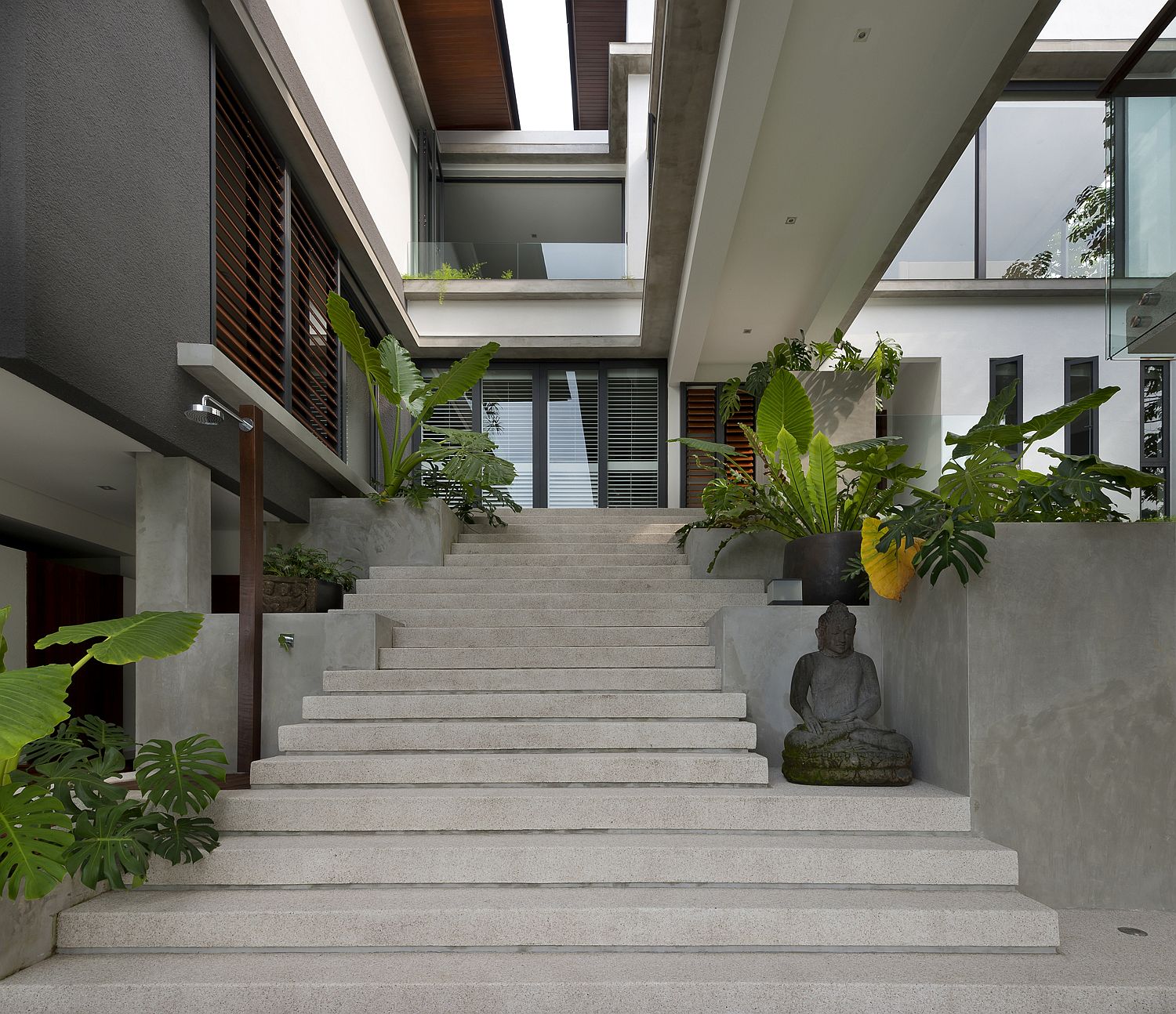 Private and modern entrance to the modern home with a forest view