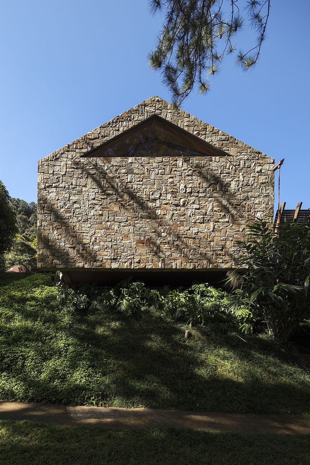 Private street facade of the AS House in stone