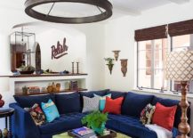 Sectional-in-navy-blue-anchors-this-open-plan-living-area-217x155