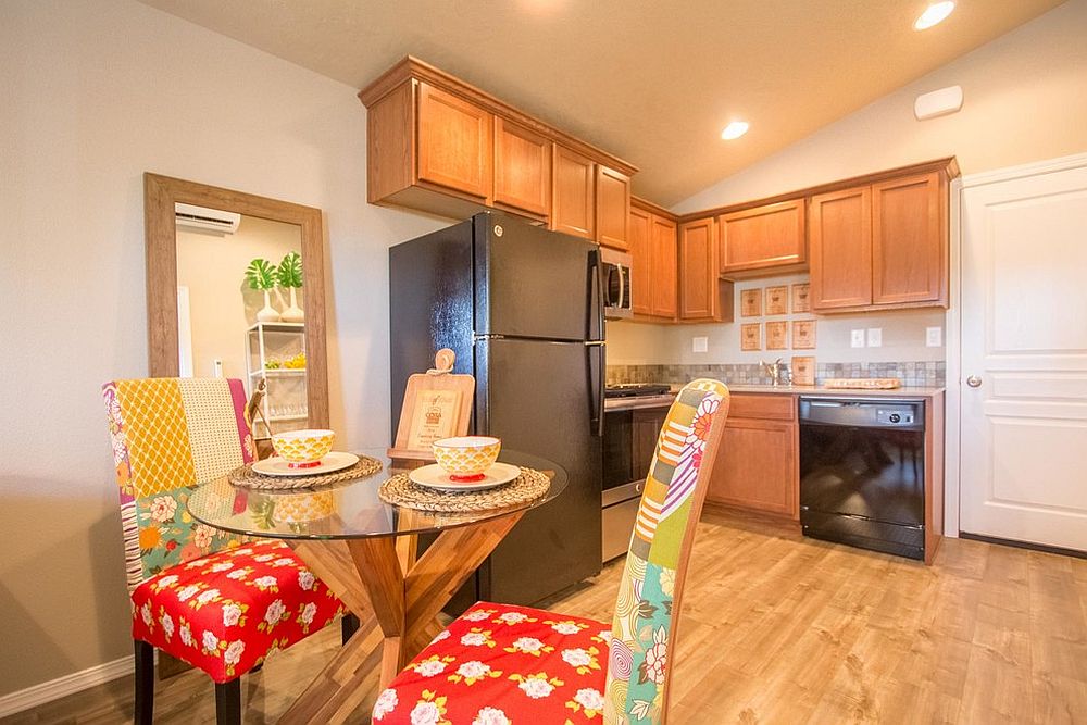 Small dining room with chairs that add plenty of color to the setting