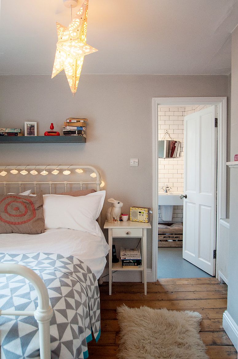 Smartly decorated bed frame using string lights in the eclectic bedroom