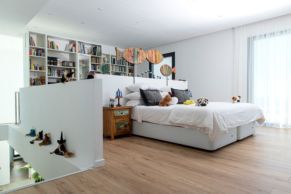 Space behind the bed along with the large shelf is used for study