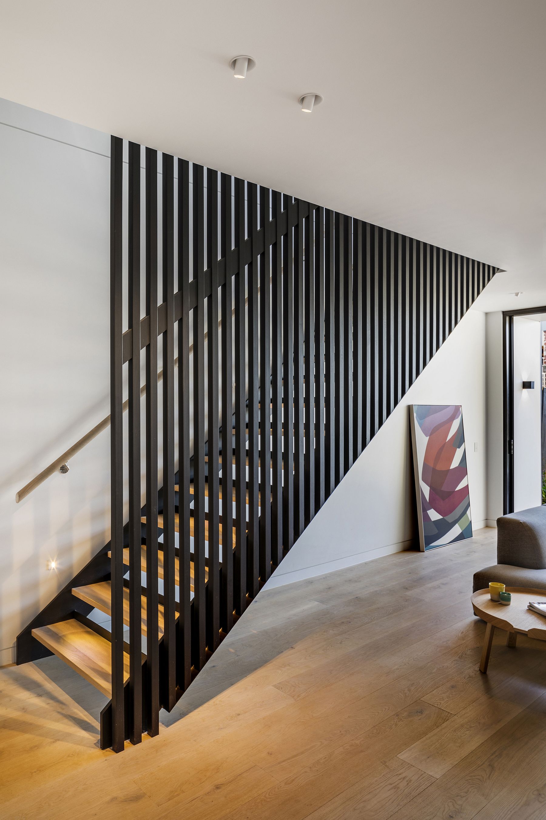 Staircase feels both modern and organic inside the house