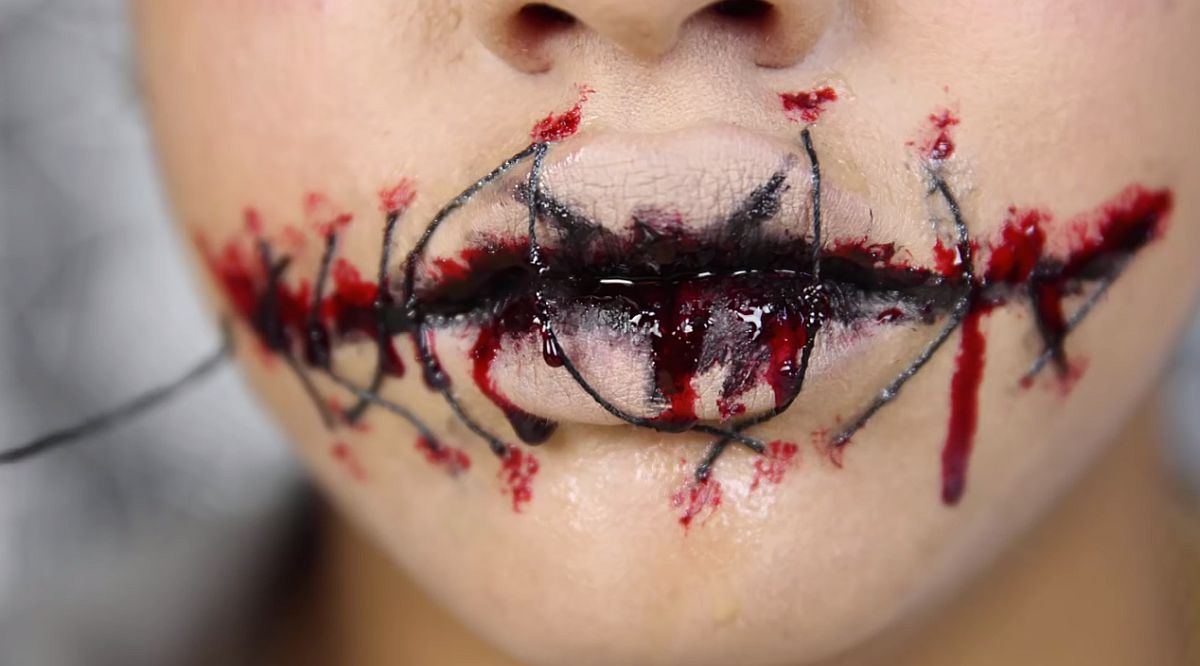 Stitched mouth and bloody lips Halloween makeup idea. 