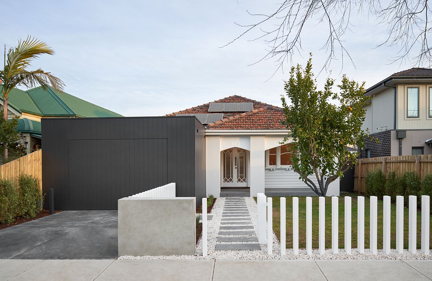 Street facade of the Melbourne House with modern extension