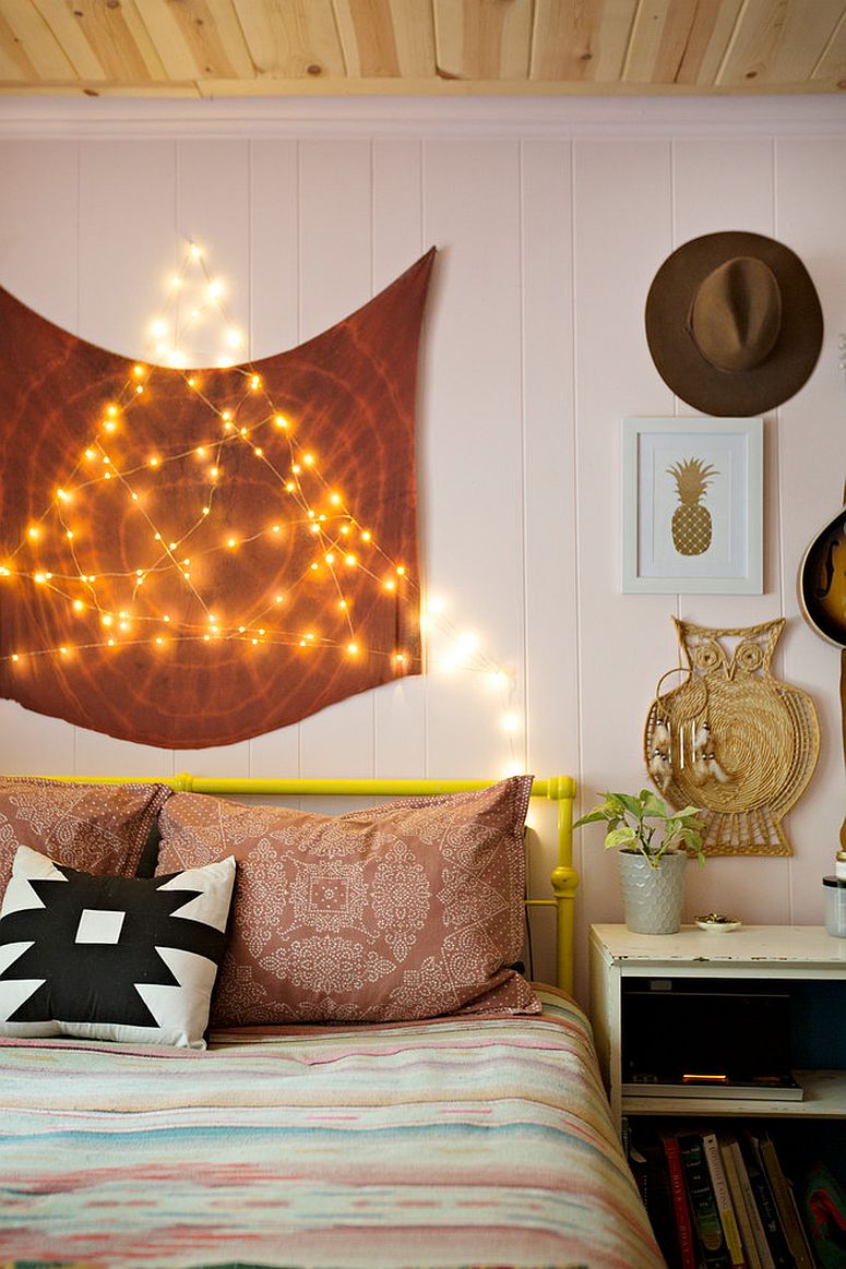 Stunningly beautiful eclectic bohemian bedroom with string lighting in the backdrop