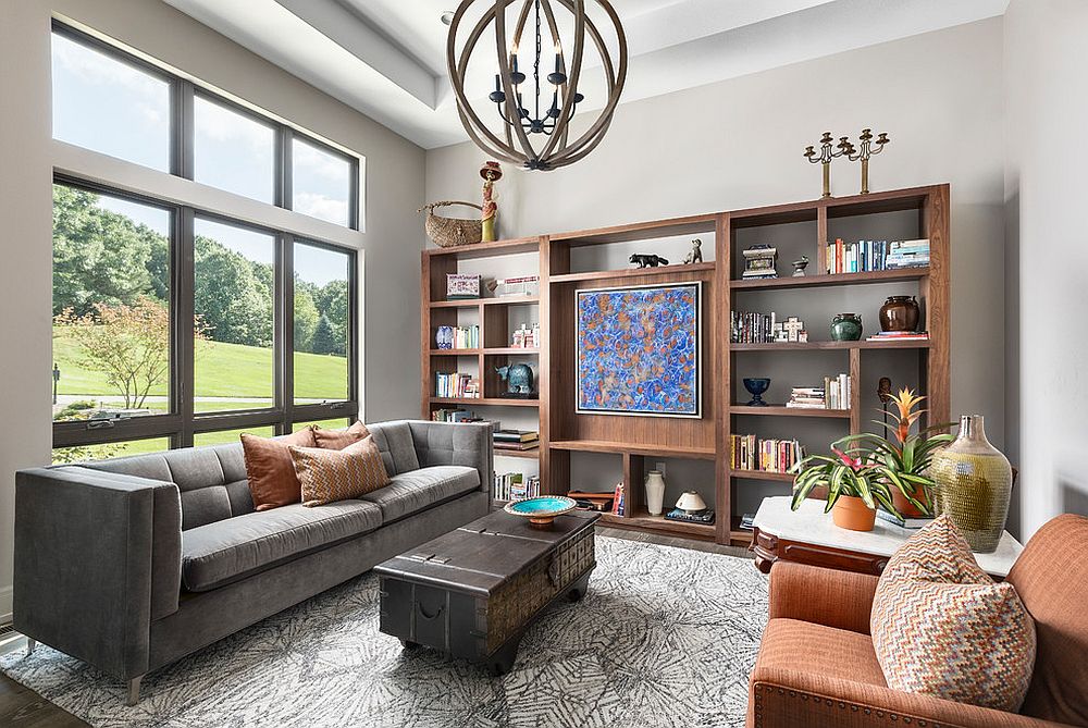 Transitional living room with custom wooden shelving that acts as a lovely display