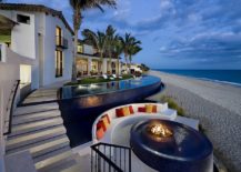 Tropical-pool-with-fire-pit-at-its-heart-next-to-the-beach-and-sunken-seating-217x155