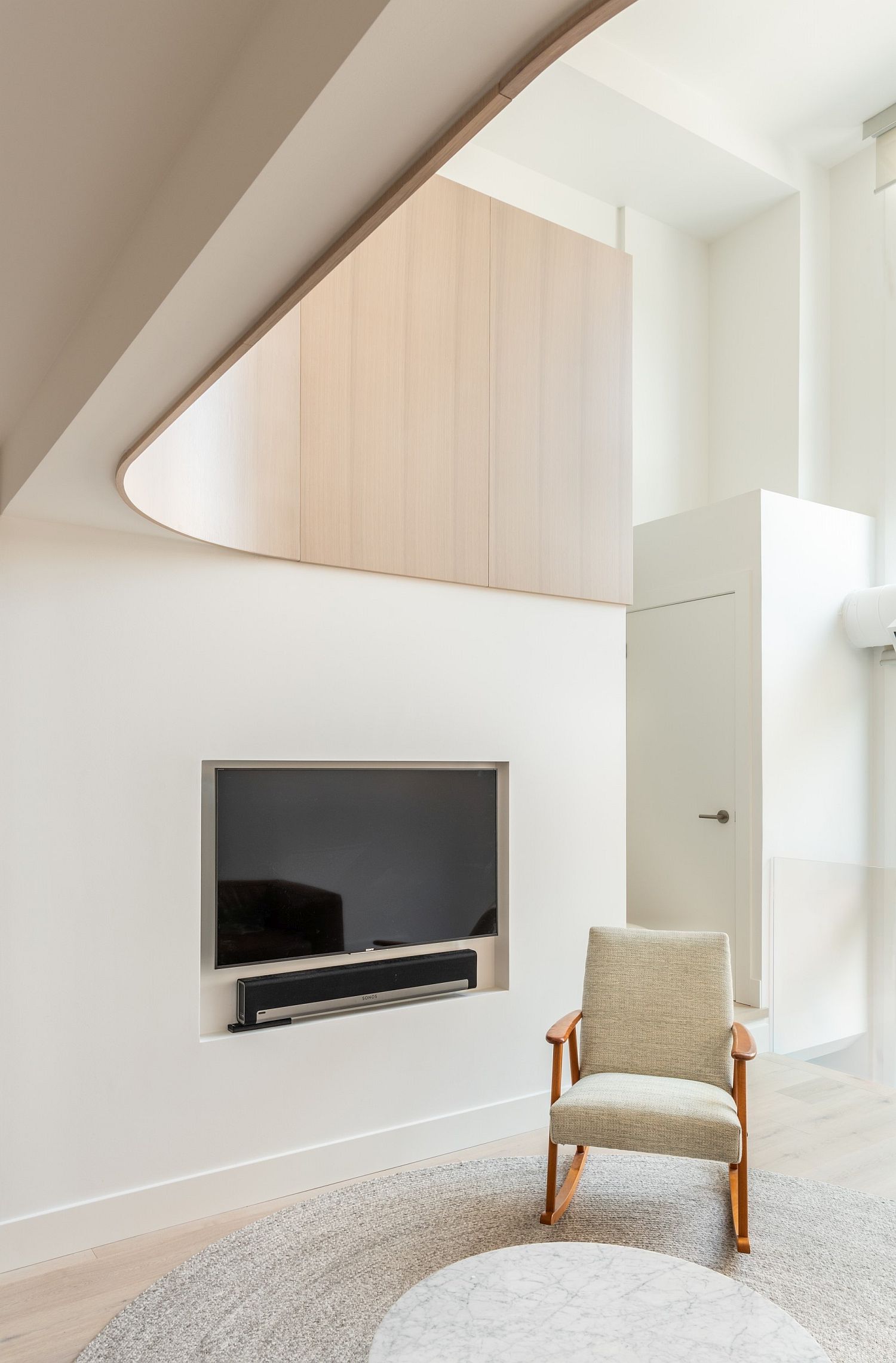 Ultra-minimal white living room of loft inside a church