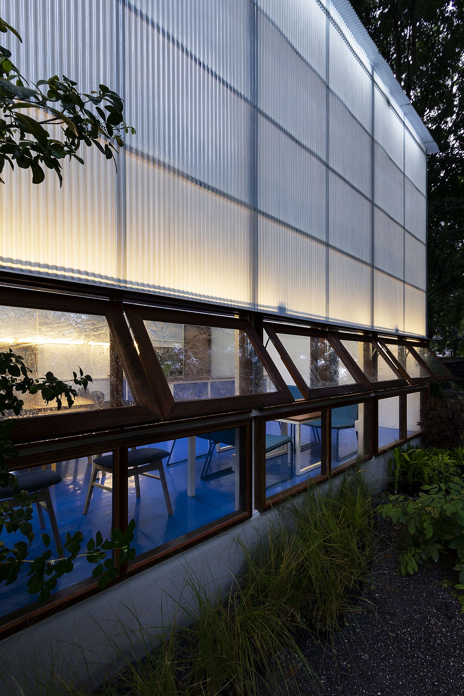 Wooden swing windows offer a peek into the library