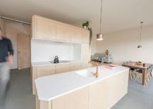 Birch-wood-and-white-Corian-kitchen-for-the-modern-home-217x155