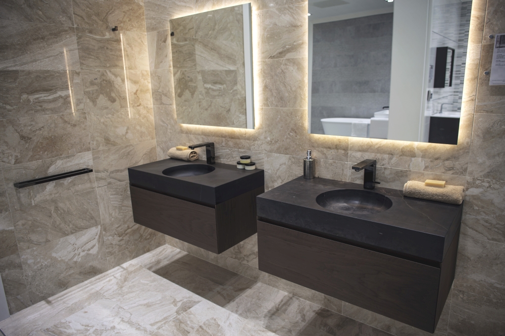 Black-stone-bathroom-vanities-with-glossy-ceramic-tiles-and-recessed-lights