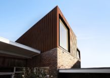Brick-coupled-with-corten-panels-creates-a-stylish-and-unique-exterior-217x155