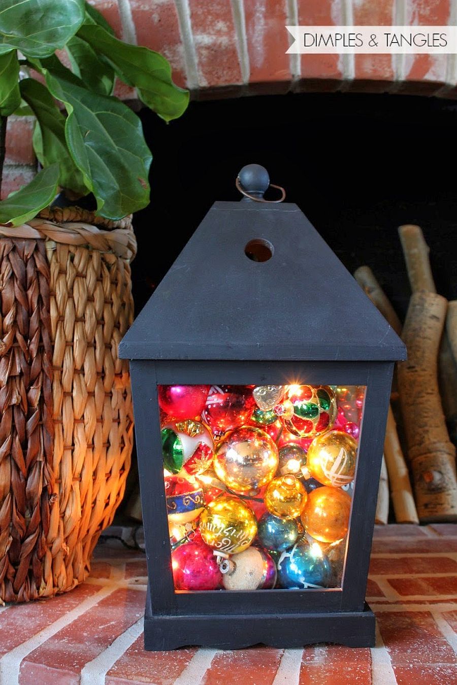 Combining lantern, string lights and Christmas ornaments in a fun and cheerful manner!