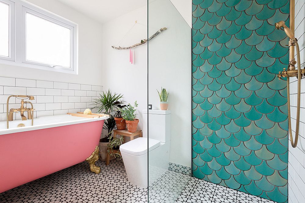 Contemporary bathroom with pink bathtub and an accent wall section with lovely tiles