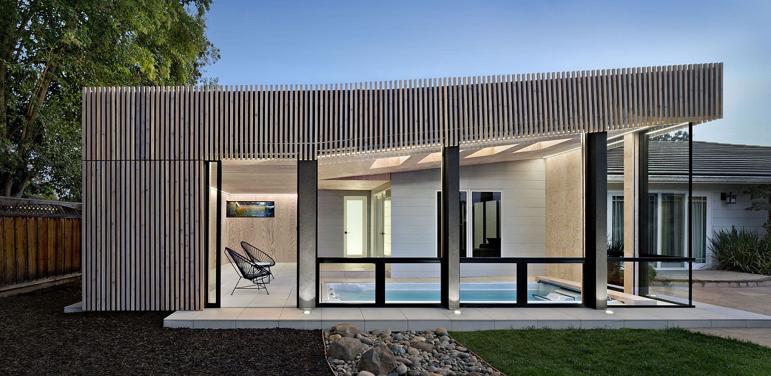 Contemporary pool house for classic Los Altos home in weathered cedar leaves the original home untouched