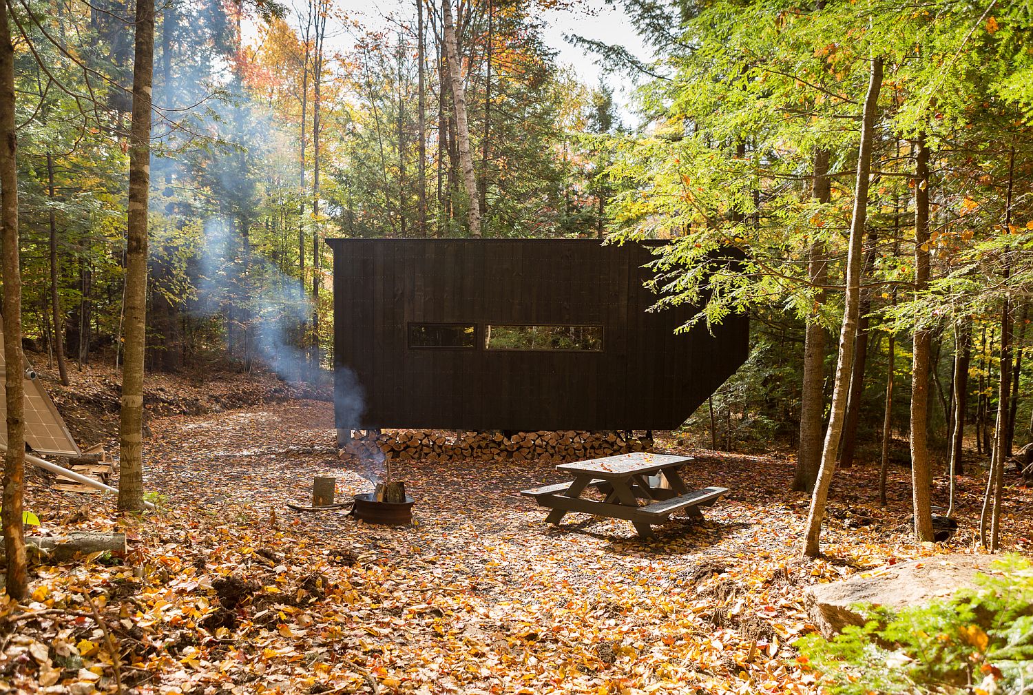 Dark and dashing exterior of the cabin helps retain heat cold weather