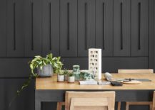 Dining-area-display-with-black-backdrop-and-wooden-dining-table-217x155