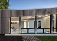 Glass-walls-bring-ample-natural-light-into-the-pool-house-during-daytime-217x155