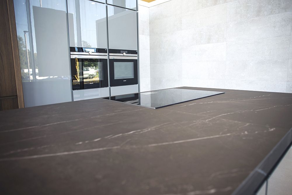 Glossy light grey kitchen with beautiful kitchen island