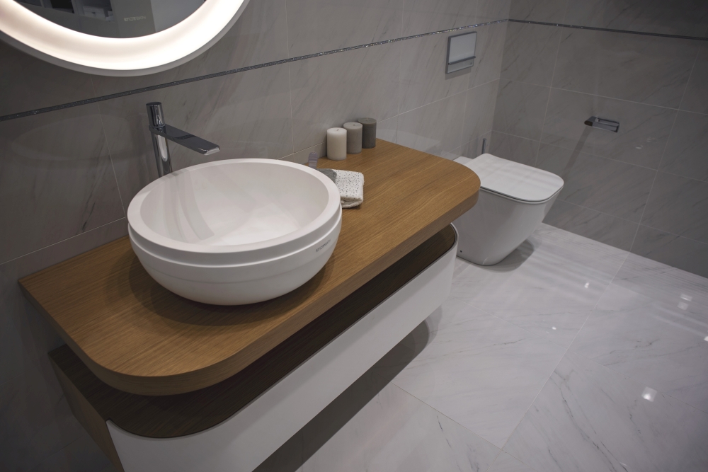 Modern bathroom with curvy vanities and wash basin