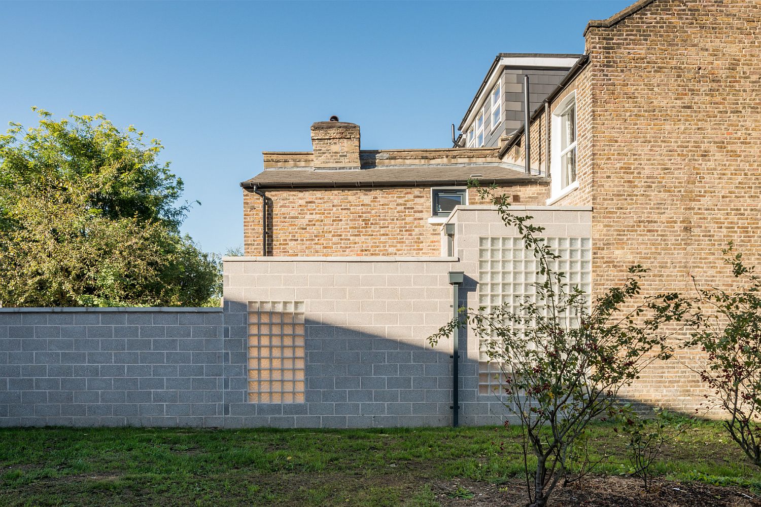 Modern cement block extension to Victorian terrace home in north-east London