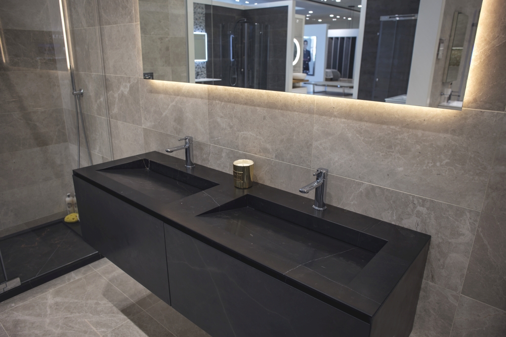 Modern dark stone vanities with glossy bathroom tiles