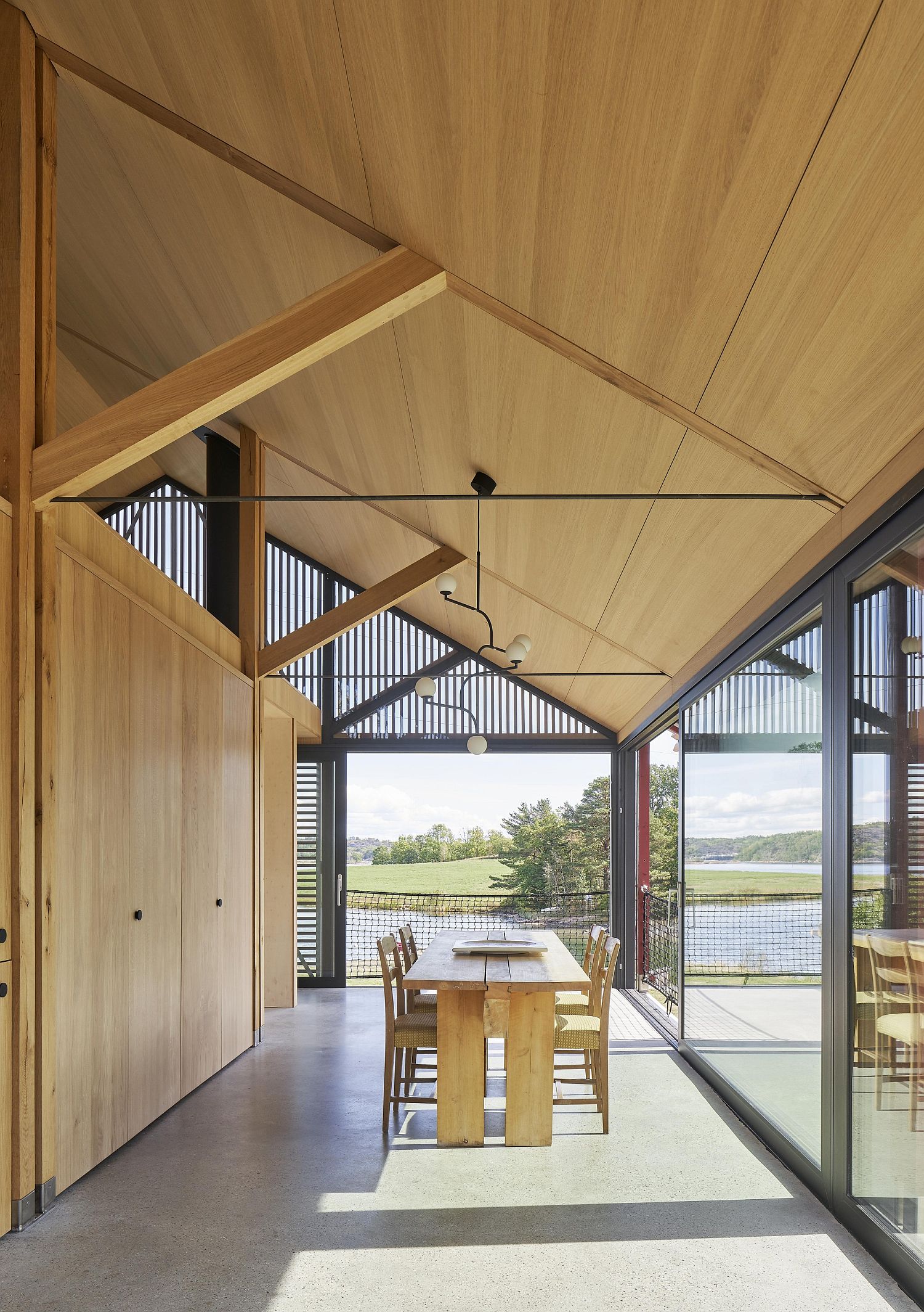 Natural light flows into the kitchen and dining area of the cabin