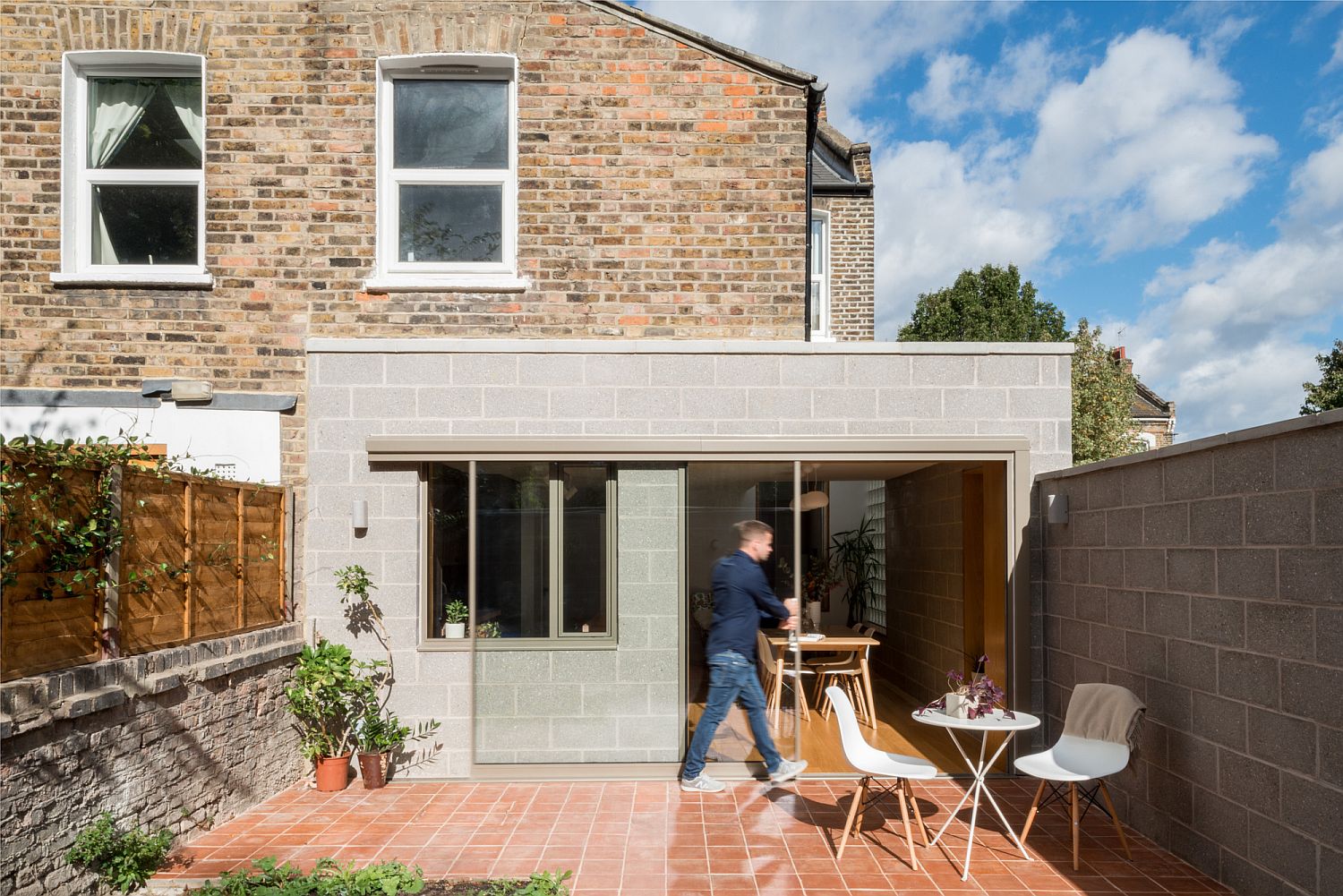 Old brick structure of the house combined with a textural modern extension