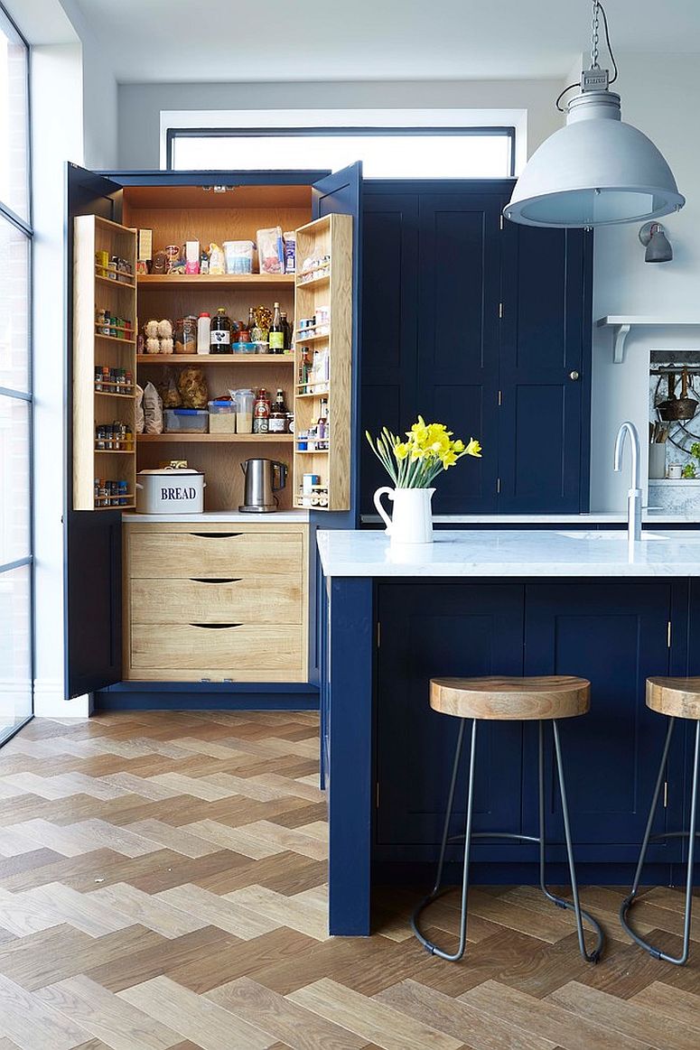 Pantry doors in blue offer additional storage space