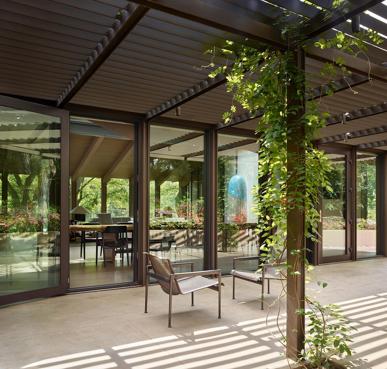 Pergola outside the Omaha home with outdoor sitting area