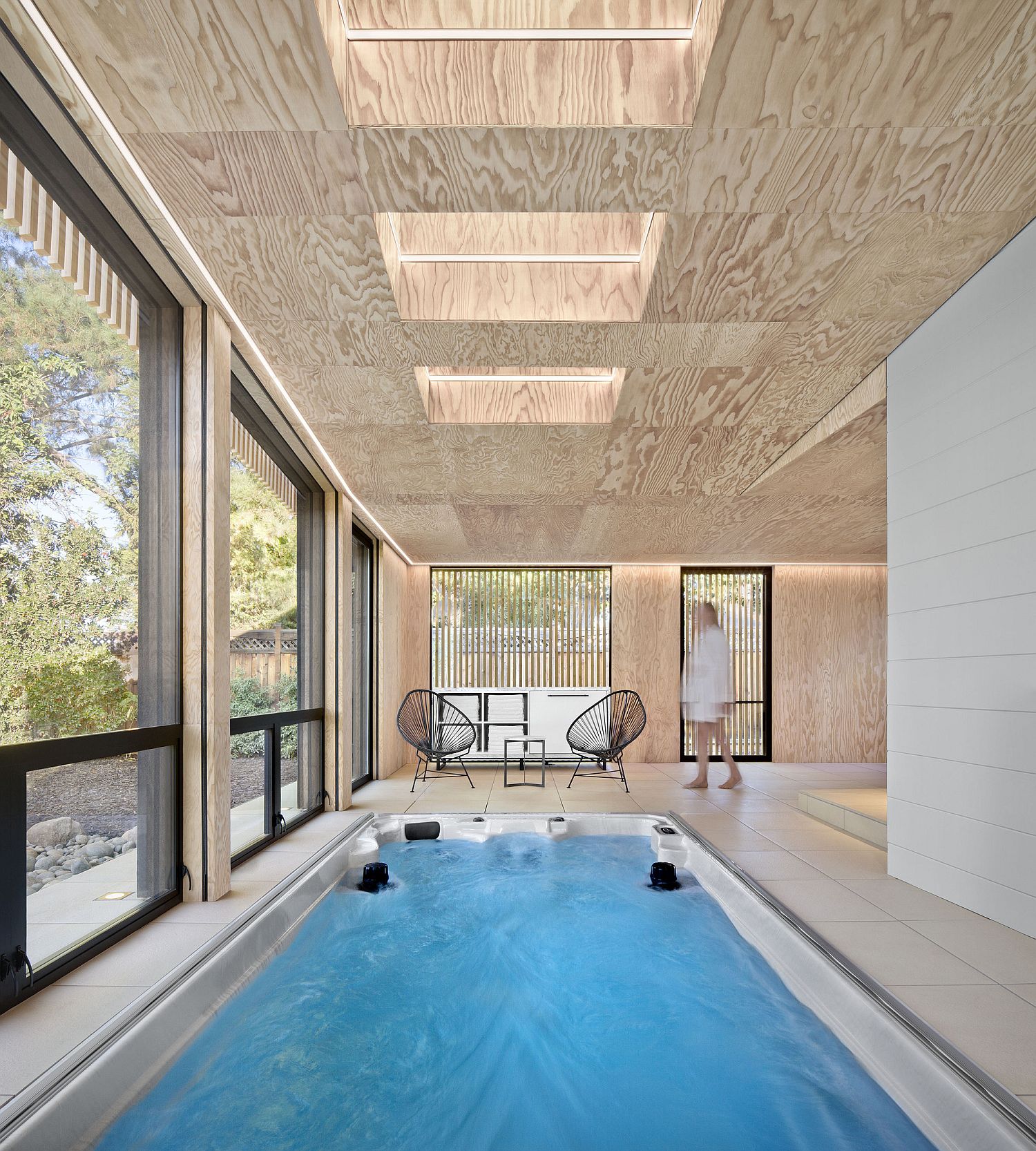 Skylights and operable rainscreens add another layer of ventilation to the stunning contemporary pool hnouse inh Los Altos