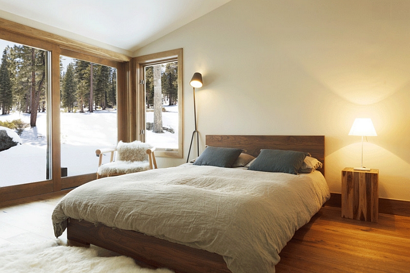 Snowy landscape outside adds to the color palette of this gorgeous bedroom