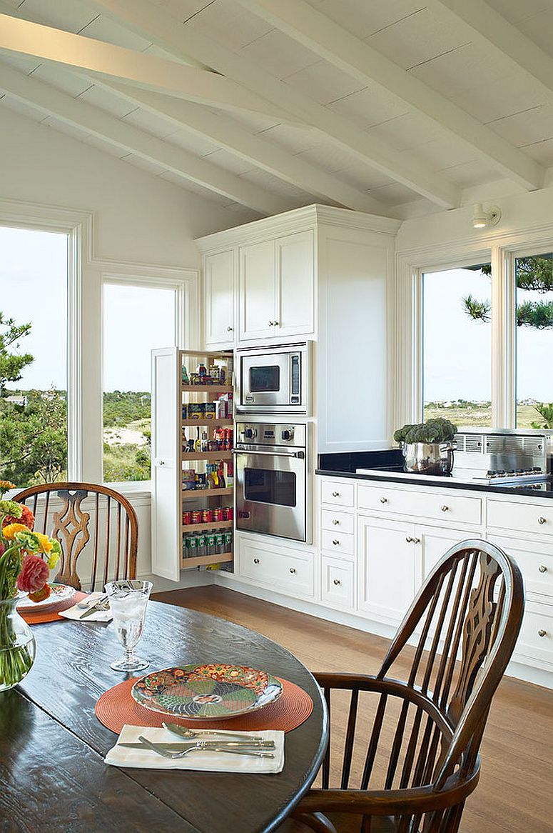 Spacious white kitchen with slim pantry design
